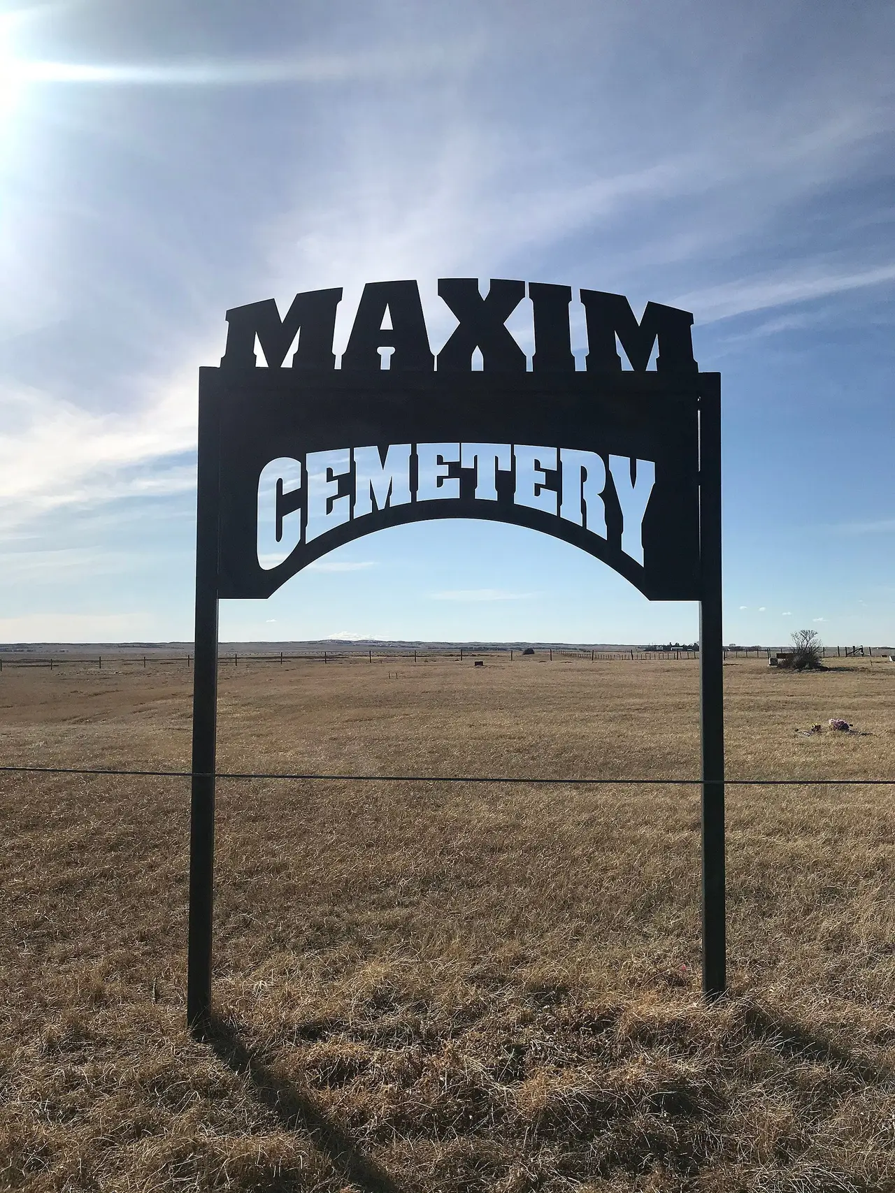 Maxim Cemetery sign on the prairie, 2020
